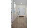 Inviting foyer featuring tile flooring, front door with glass panels, and neutral walls at 962 Marco Ne Dr, St Petersburg, FL 33702