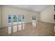Expansive living space with pool view, tile flooring, and high ceilings at 962 Marco Ne Dr, St Petersburg, FL 33702