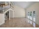 Spacious living room with high ceilings and large windows overlooking the pool area at 962 Marco Ne Dr, St Petersburg, FL 33702