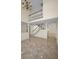 Open-concept living area with high ceilings, staircase, and lots of natural light at 962 Marco Ne Dr, St Petersburg, FL 33702