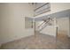 Spacious living room with high ceilings, staircase, and neutral color palette at 962 Marco Ne Dr, St Petersburg, FL 33702