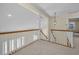 Spacious loft area with railing overlooking the floor below at 962 Marco Ne Dr, St Petersburg, FL 33702