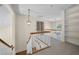 Upstairs landing with staircase and chandelier, showcasing an open floor plan at 962 Marco Ne Dr, St Petersburg, FL 33702
