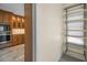 Pantry with ample shelving space adjacent to an updated kitchen at 962 Marco Ne Dr, St Petersburg, FL 33702