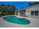 Beautiful in-ground pool area with surrounding pavers, offering a private outdoor retreat at 962 Marco Ne Dr, St Petersburg, FL 33702