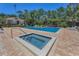 Enjoy a relaxing community pool with a spa, lounge chairs, and a clubhouse at 962 Marco Ne Dr, St Petersburg, FL 33702