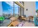Inviting balcony with waterfront views, comfortable seating, and a tranquil atmosphere at 1 Key Capri # 211W, Treasure Island, FL 33706