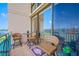 Charming balcony with seating, perfect for enjoying waterfront views and outdoor relaxation at 1 Key Capri # 211W, Treasure Island, FL 33706