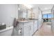 The bathroom has a updated vanity with stone countertops, lots of storage and beautiful water views at 1 Key Capri # 211W, Treasure Island, FL 33706