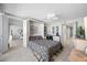 Comfortable bedroom features a murphy bed, built-in desk area and light wood-style tile flooring at 1 Key Capri # 211W, Treasure Island, FL 33706