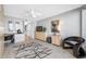 Comfortable bedroom features a murphy bed, built-in desk area and light wood-style tile flooring at 1 Key Capri # 211W, Treasure Island, FL 33706
