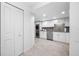 Bright kitchen with stainless steel appliances, modern cabinets, and a convenient in-unit washer/dryer at 1 Key Capri # 211W, Treasure Island, FL 33706