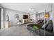 Modern living room with comfortable leather seating, stylish decor, and light wood floors at 1 Key Capri # 211W, Treasure Island, FL 33706