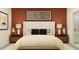 Serene bedroom with neutral bedding, decorative pillows, and well-lit nightstands at 10870 Rustic Eve Ct, Land O Lakes, FL 34638
