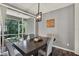 Bright dining area with modern lighting, hardwood floors, and access to the outdoor patio at 11041 Black Swan Ct, Seffner, FL 33584