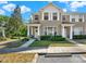 Charming townhome featuring a welcoming front porch, lush landscaping and neutral colored siding at 11041 Black Swan Ct, Seffner, FL 33584