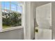Laundry area with stacked washer and dryer next to window at 11041 Black Swan Ct, Seffner, FL 33584