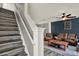 Cozy living room with hardwood floors and view of stairway at 11041 Black Swan Ct, Seffner, FL 33584
