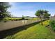 Expansive backyard with lush green lawn and privacy fence at 11548 Crowned Sparrow Ln, Tampa, FL 33626