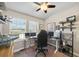Bedroom with 2 windows for plenty of light over the office desk and ceiling fan at 11548 Crowned Sparrow Ln, Tampa, FL 33626