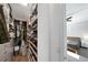 Walk-in closet with built-in shelving and storage space for organized clothing and accessories at 11548 Crowned Sparrow Ln, Tampa, FL 33626