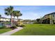 Scenic view of the community with pond, fountain, lush greenery, and inviting walkways at 11548 Crowned Sparrow Ln, Tampa, FL 33626