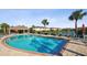 Resort-style pool featuring lounge chairs, cabana, and ample seating at 11548 Crowned Sparrow Ln, Tampa, FL 33626