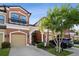 Charming multi-story townhome featuring a private balcony and attached garage at 11548 Crowned Sparrow Ln, Tampa, FL 33626