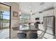 Modern kitchen with granite counters, stainless steel appliances, and a breakfast bar at 11548 Crowned Sparrow Ln, Tampa, FL 33626