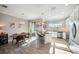 Sun-lit kitchen with stainless steel appliances and a view to the dining area at 11548 Crowned Sparrow Ln, Tampa, FL 33626