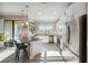 Modern kitchen equipped with stainless steel appliances and an island with seating at 11548 Crowned Sparrow Ln, Tampa, FL 33626