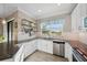 Bright kitchen showcasing granite countertops, subway tile backsplash, and stainless steel appliances at 11548 Crowned Sparrow Ln, Tampa, FL 33626