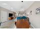 Open concept living space including a dining area, living room, and kitchen view at 11548 Crowned Sparrow Ln, Tampa, FL 33626