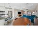 Bright living space featuring an open kitchen, dining area, and living room at 11548 Crowned Sparrow Ln, Tampa, FL 33626