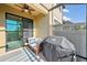 Spacious screened-in patio with comfortable seating and a grilling area at 11548 Crowned Sparrow Ln, Tampa, FL 33626