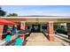View of the pool cabana with ceiling fans, tables, chairs, and ample seating at 11548 Crowned Sparrow Ln, Tampa, FL 33626