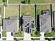 Aerial view of home with solar panels; large backyard and surrounding homes visible at 11625 Tetrafin Dr, Riverview, FL 33579
