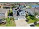 Aerial view of a home with solar panels, a spacious yard, and a well-maintained community at 11625 Tetrafin Dr, Riverview, FL 33579