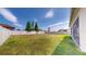 Large, level backyard with a white fence, ideal for outdoor activities at 11625 Tetrafin Dr, Riverview, FL 33579