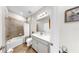 Well-lit bathroom featuring a shower-tub combo, white vanity, and neutral color palette at 11625 Tetrafin Dr, Riverview, FL 33579