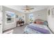 Bright bedroom with a ceiling fan, carpet, and a window with a view at 11625 Tetrafin Dr, Riverview, FL 33579