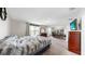 Spacious bedroom with a comfortable bed, large window with curtains, and a desk, perfect for relaxation at 11625 Tetrafin Dr, Riverview, FL 33579