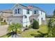 Beautiful two-story home with a well-manicured lawn, vibrant plants, and an inviting facade at 11625 Tetrafin Dr, Riverview, FL 33579
