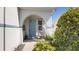 Inviting front porch with a comfortable swing chair and attractive landscaping at 11625 Tetrafin Dr, Riverview, FL 33579