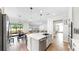 Contemporary kitchen with a central island, stainless steel sink, and open layout to the living area at 11625 Tetrafin Dr, Riverview, FL 33579