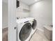 Efficient laundry room featuring a large washer and dryer, perfect for any homeowner at 11625 Tetrafin Dr, Riverview, FL 33579