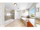 Bright bathroom with a soaking tub, separate shower, and elegant fixtures offers a spa-like experience at 11625 Tetrafin Dr, Riverview, FL 33579