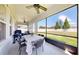 Spacious covered patio area with dining and seating, perfect for entertaining at 11625 Tetrafin Dr, Riverview, FL 33579