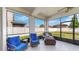Screened patio with comfortable seating, perfect for enjoying the outdoors while protected from the elements at 11625 Tetrafin Dr, Riverview, FL 33579