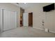 Comfortable bedroom featuring a closet, an open doorway to the bathroom, and a mounted TV at 11716 Summer Springs Dr, Riverview, FL 33579